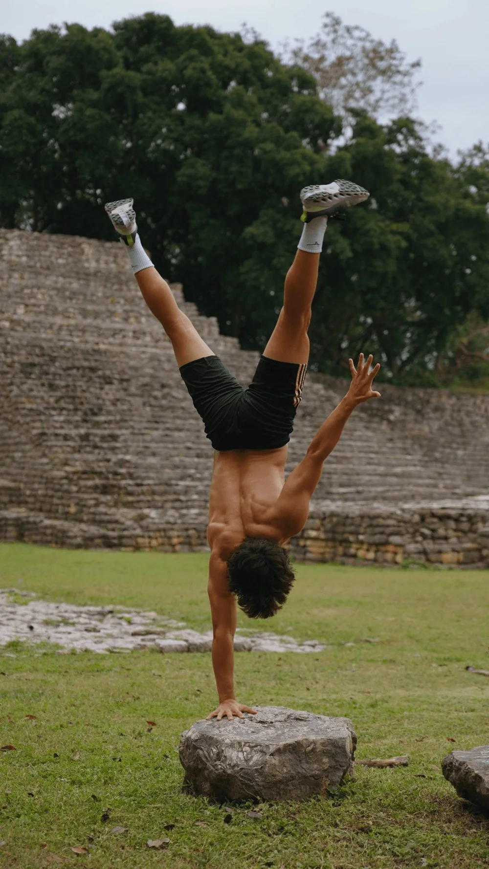 A person doing a handstand outdoors